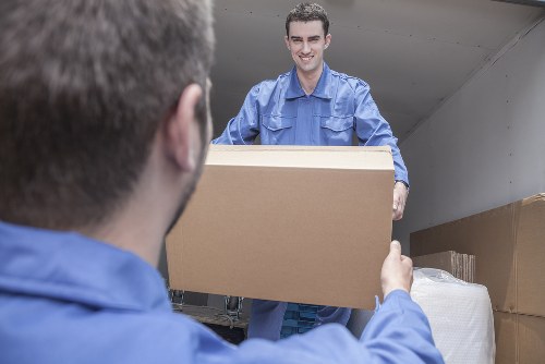 Removal team planning a move in a Mayfair street