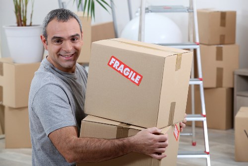 Removal team preparing furniture for a booked relocation service