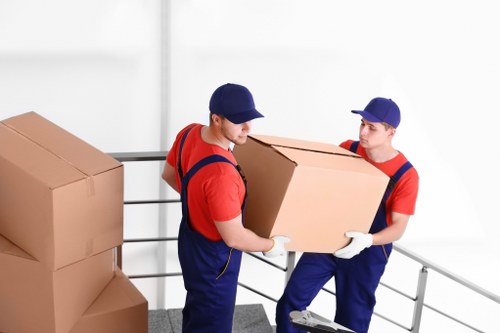 Packed moving boxes and furniture for a Mayfair home relocation
