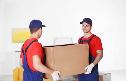 Moving boxes and protective wrapping prepared for a Mayfair relocation