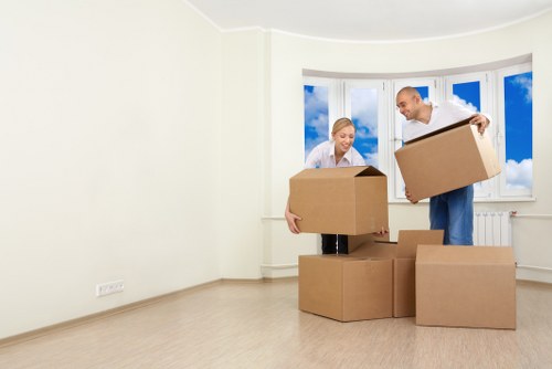 Moving team loading boxes near a Mayfair property