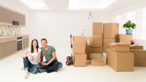 Packed moving boxes and furniture protection for a Mayfair home removal