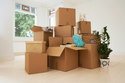Professional office removals planning in Mayfair with packed boxes and business furniture