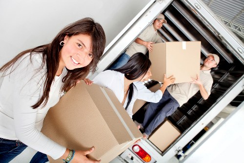 Staff handling belongings during a removal service