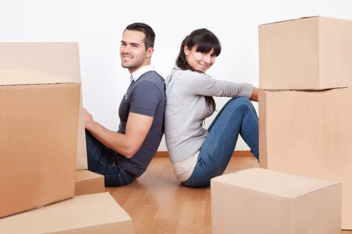 Professional removals team handling furniture in a Mayfair property
